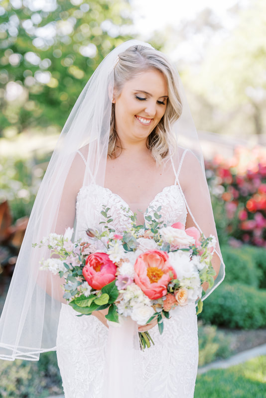 bride with bouquet done by Fully Belly Farm