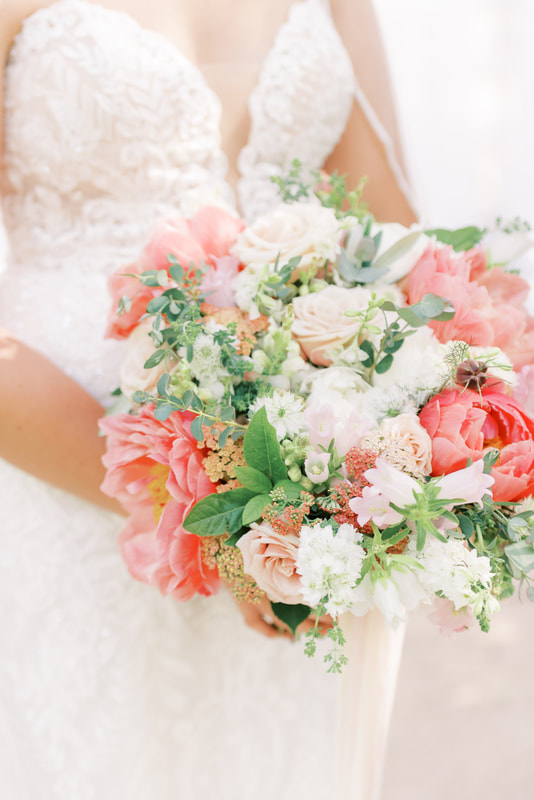 Bridal bouquet with hot pink peonies, garden roses and blush flowers