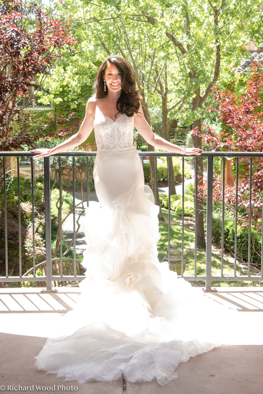 Bride in a satin mermaid with ruffles by Lazaro