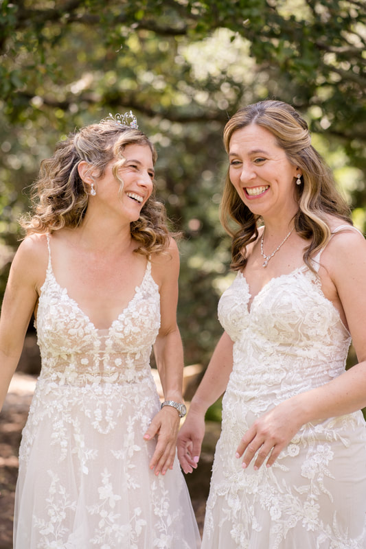 Brides in lace wedding gowns for their summer wedding
