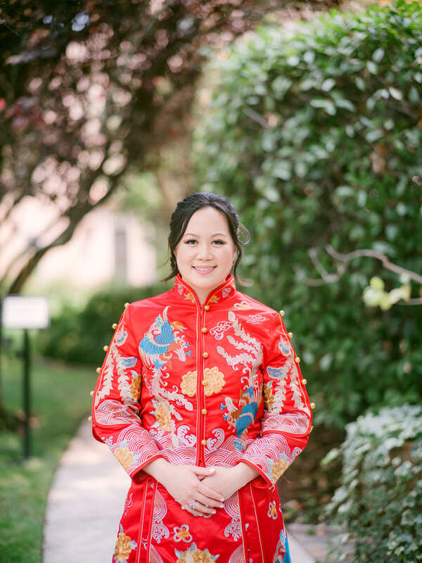bride in traditional qipao dress for tea ceremony